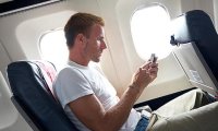 Минтранс собирается отменить запрет на использование мобильных в самолетах