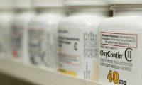 Несколько штатов выступили против урегулирования конфликта между производителем OxyContin и министерством юстиции