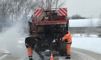 Ростовские дорожники снова укладывают асфальт в снег